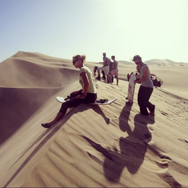 Go sandboarding on the highest dunes of the world?